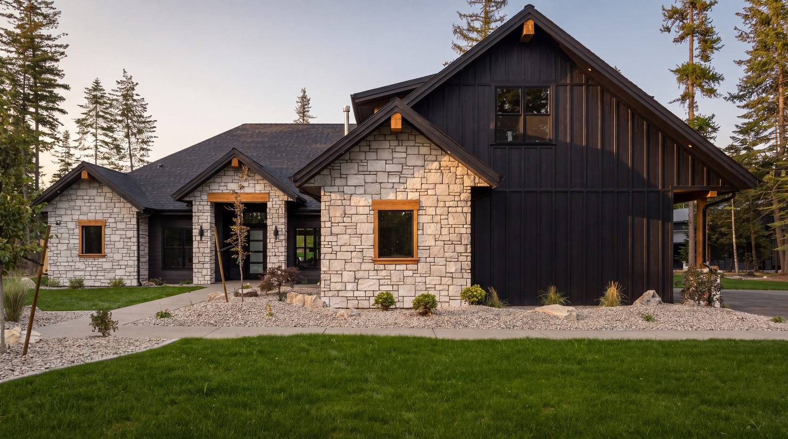 Custom home under a crisp gable roofline in board and batten, stone and cedar